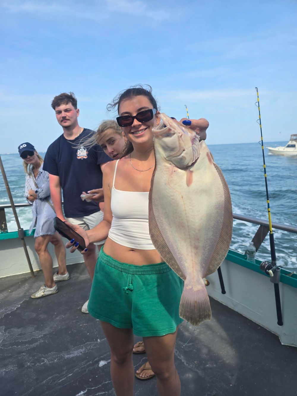 a person holding a fish in the water