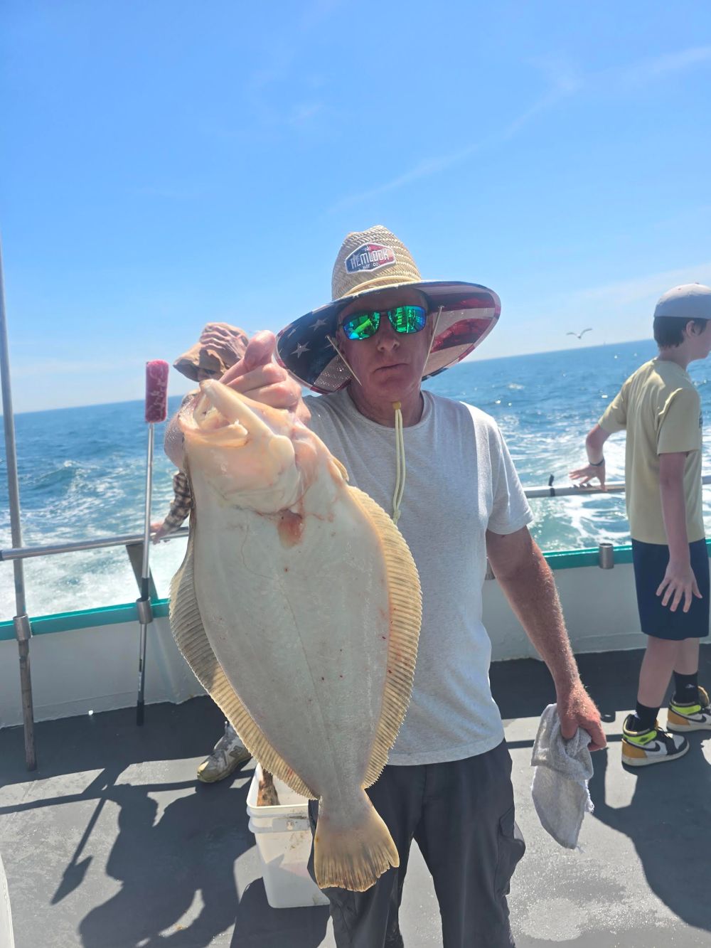 a person holding a fish in the water
