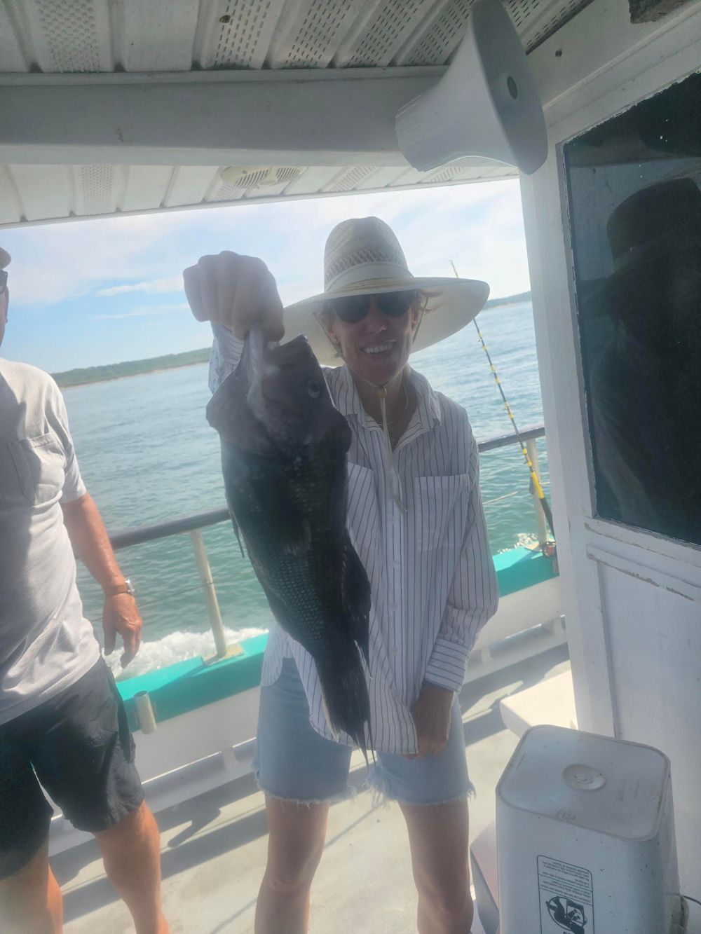 a man standing next to a boat