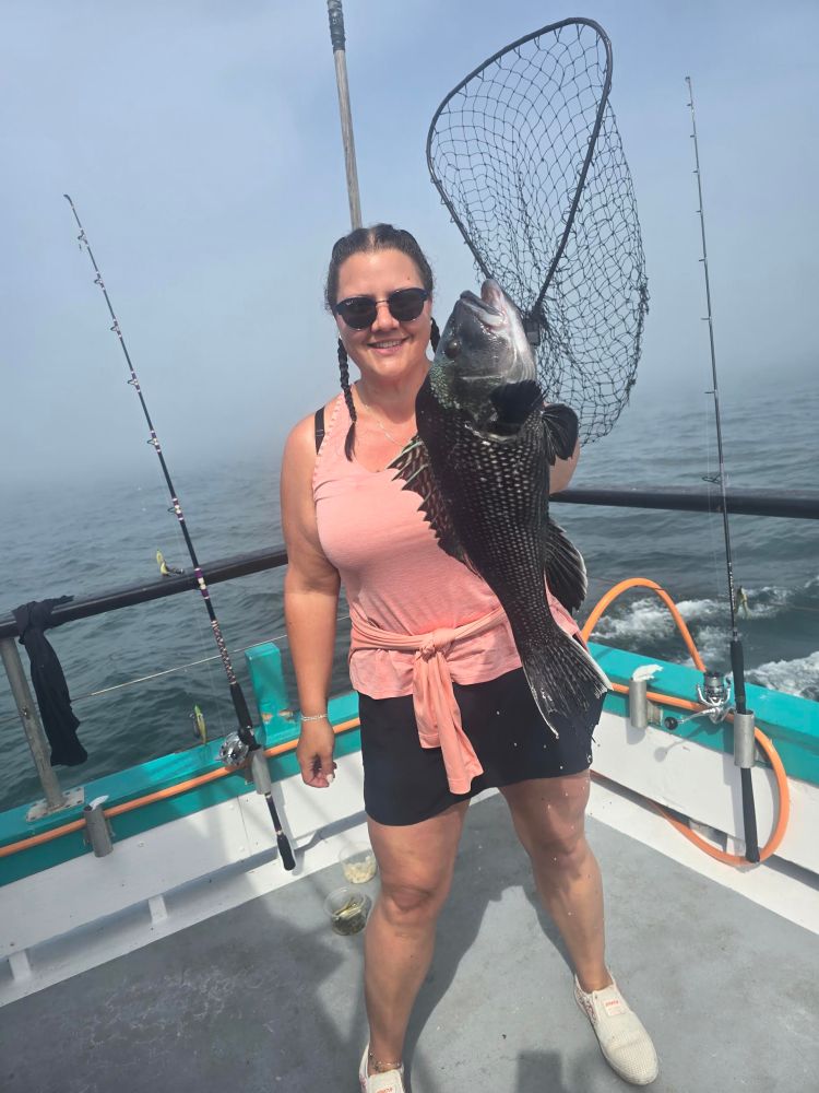 a person standing on a boat in the water