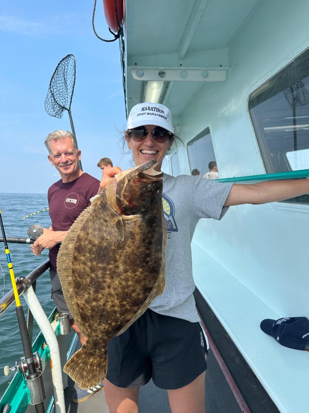 a man holding a fish