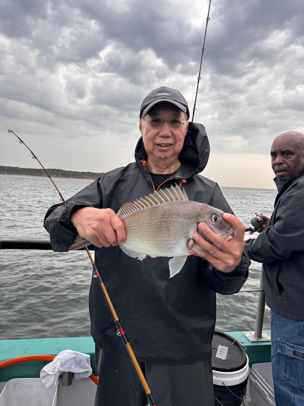 a person holding a fish in the water