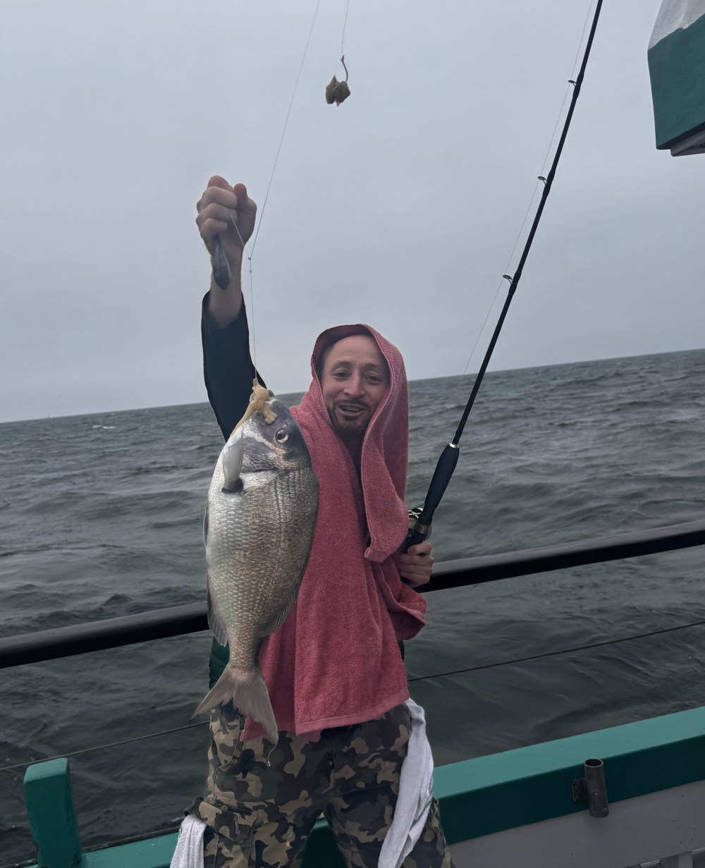 a person standing next to a body of water