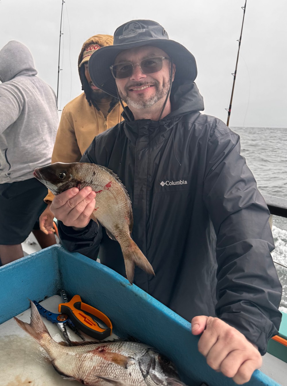 a person holding a fish