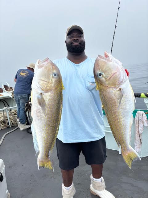 a man holding a fish