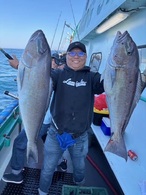a man holding a fish