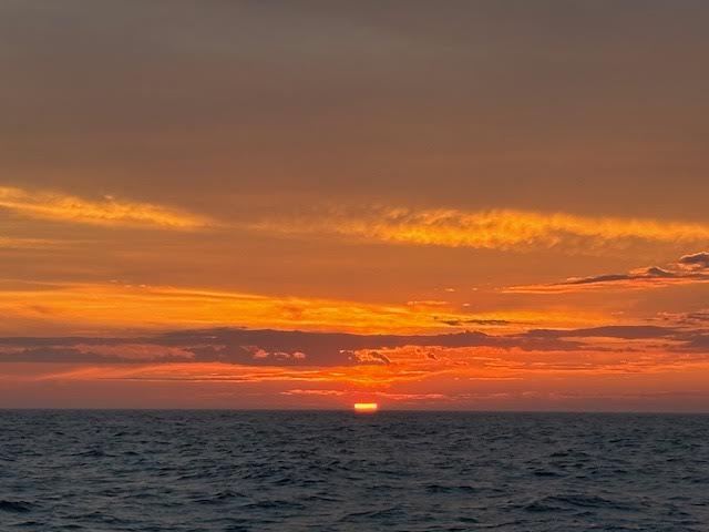 a sunset over a body of water