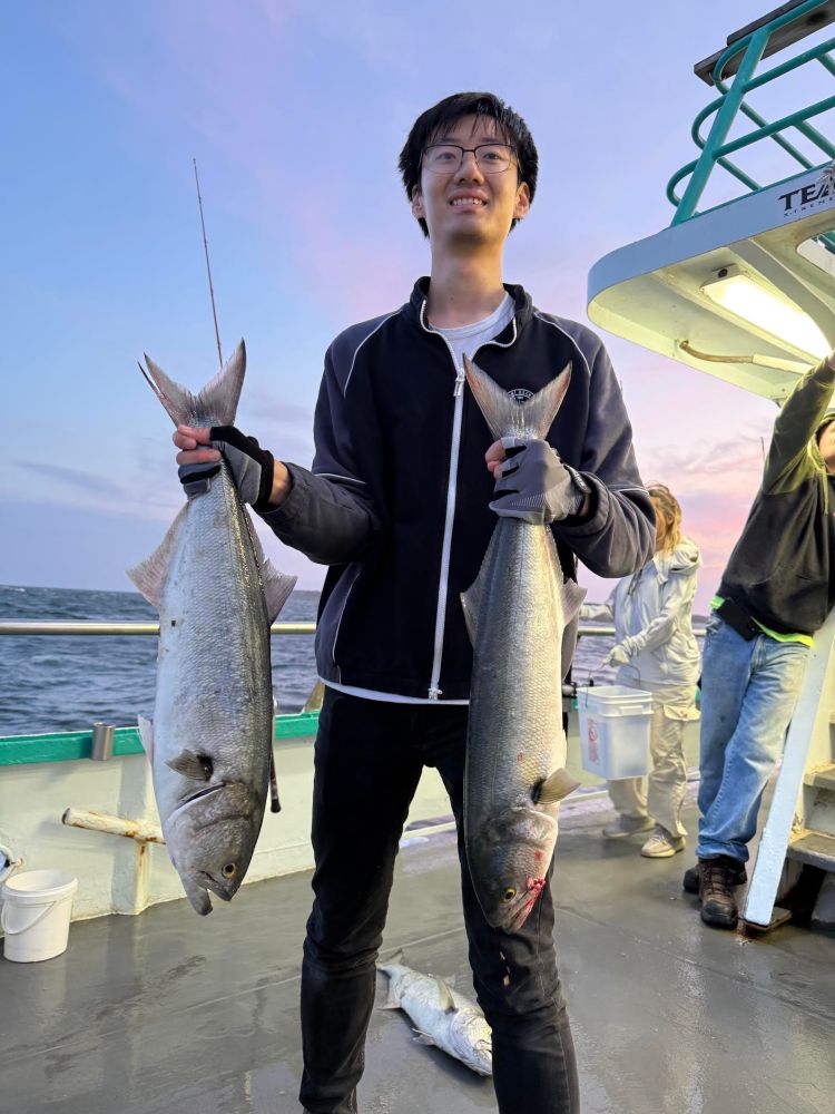a man holding a fish