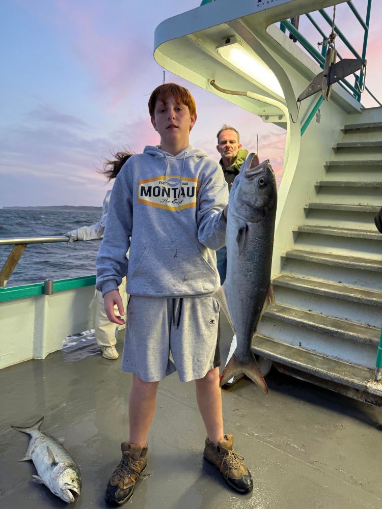 a person holding a fish