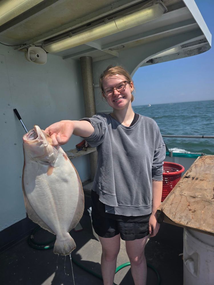 a man holding a fish