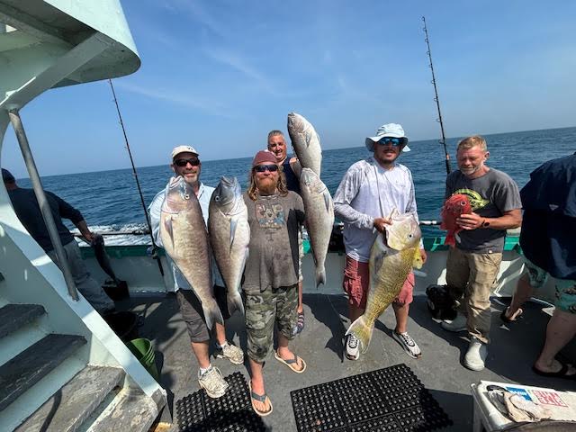 a group of people on a boat in the water