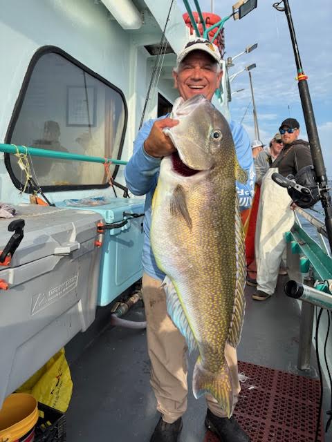 a man holding a fish