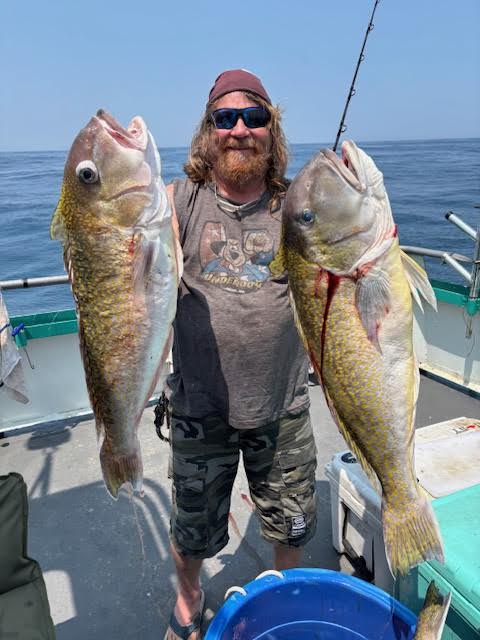 a man holding a fish