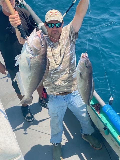 a person holding a fish