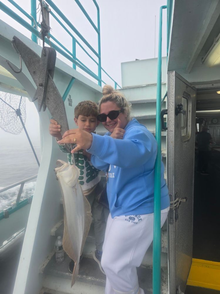 a person holding a fish