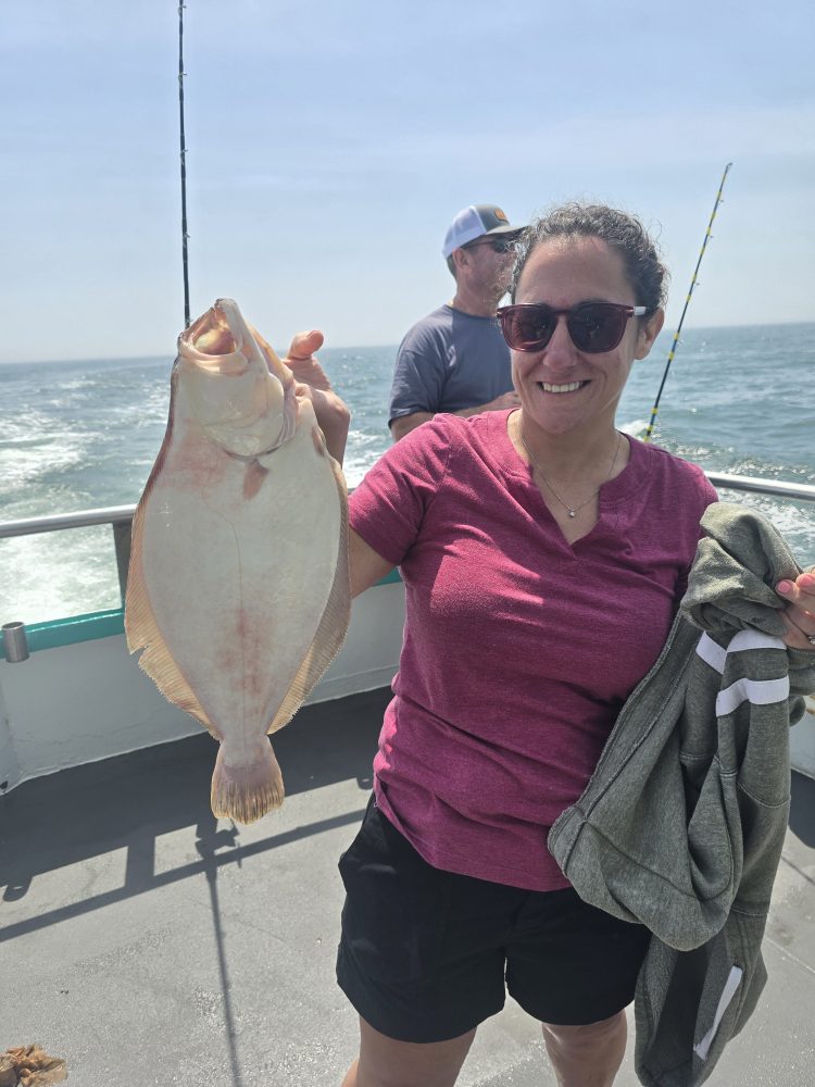 a person holding a fish