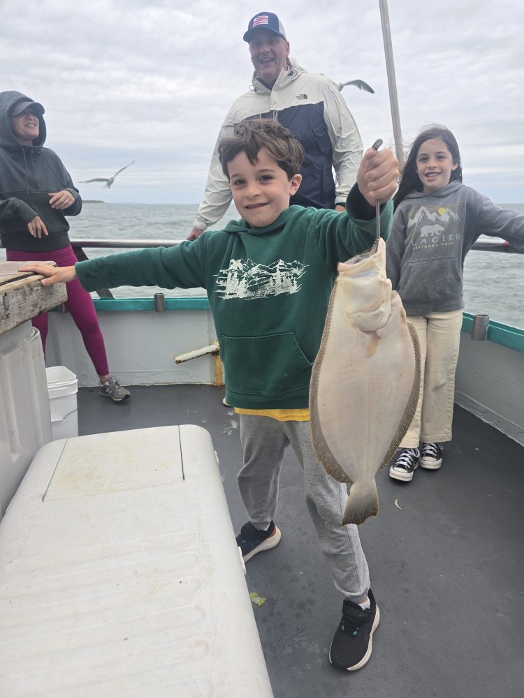 a group of people standing in a parking lot