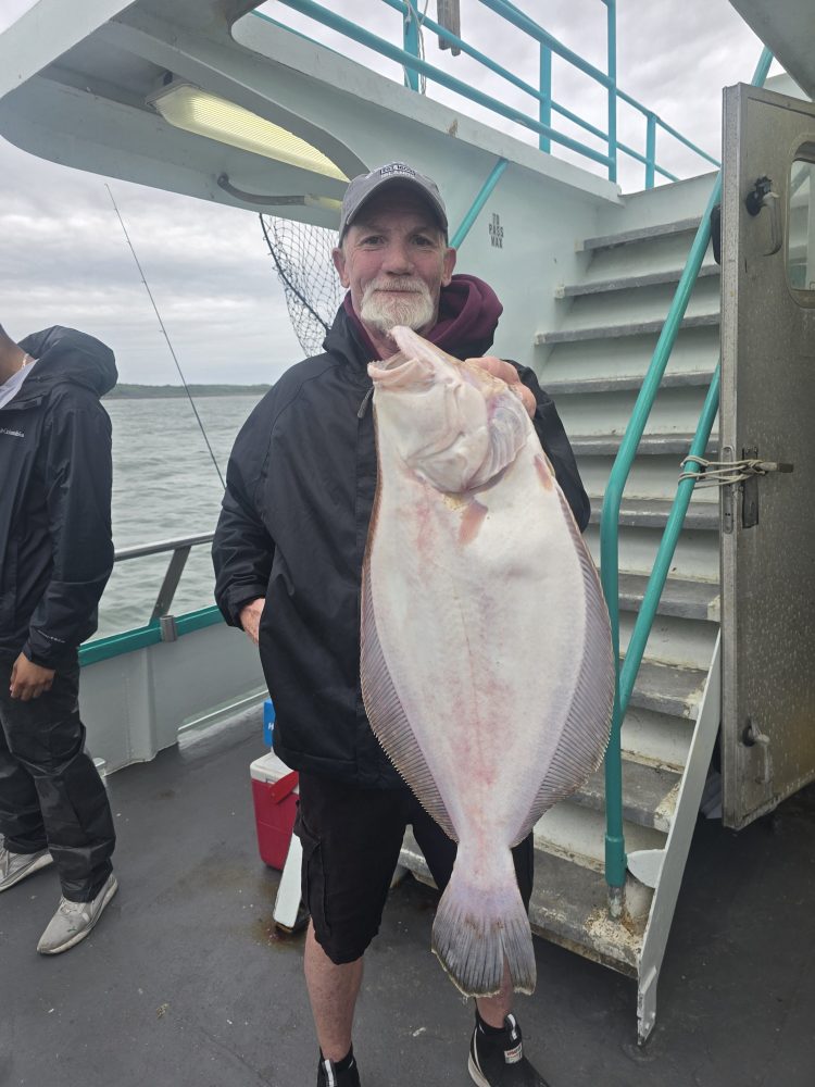 a person holding a fish