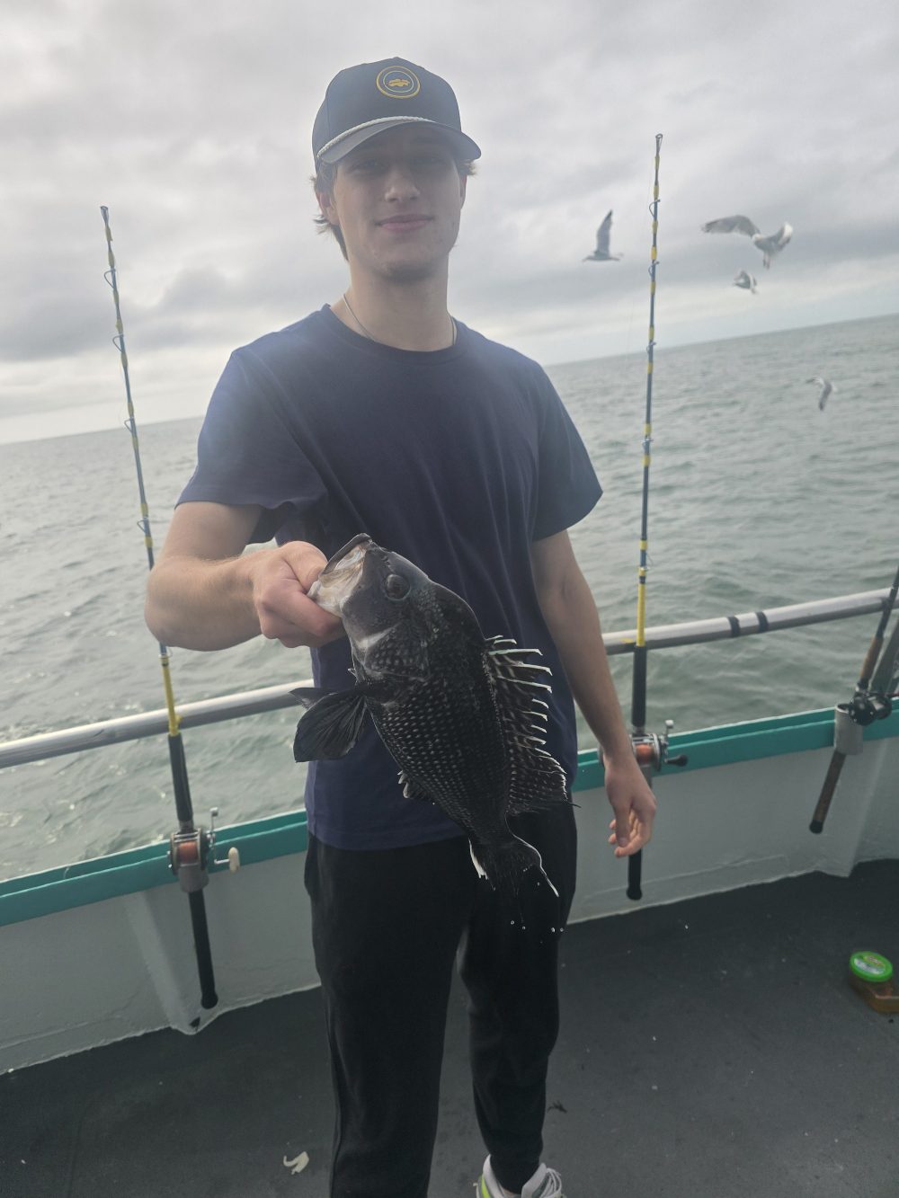 a person standing next to a boat