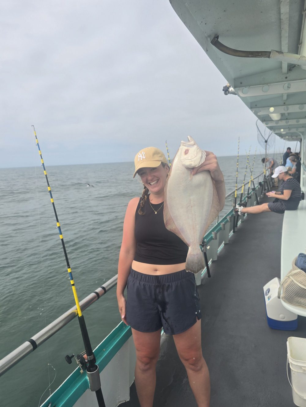 a person standing on a boat in the water
