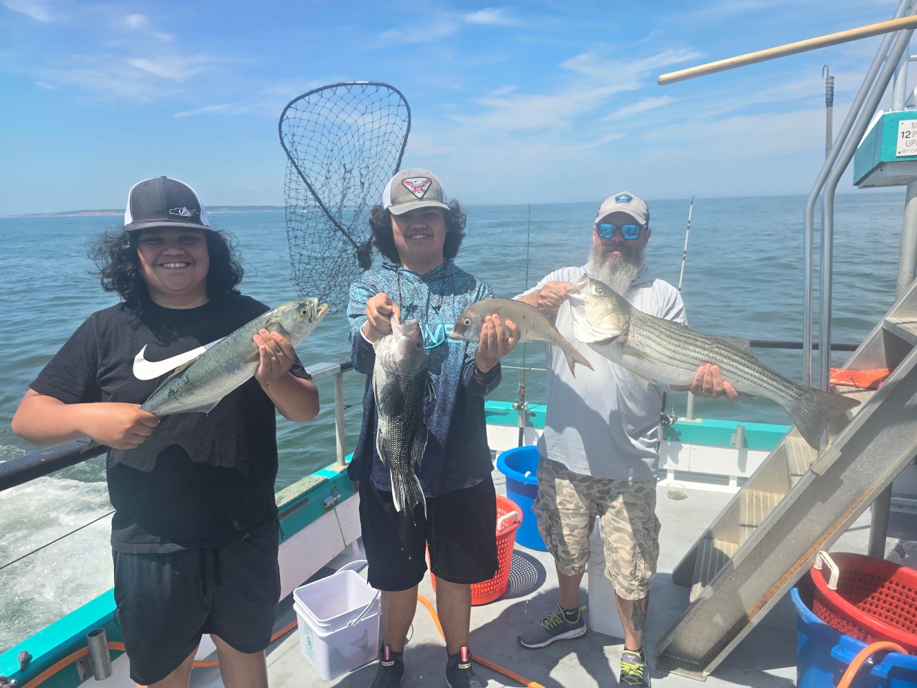 a person holding a fish on a boat