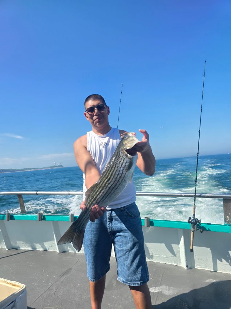 a man standing in front of a pier