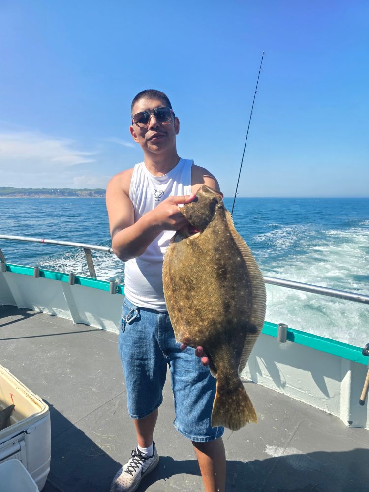 a person holding a fish in the water