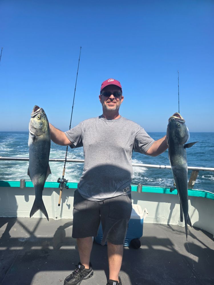 a person holding a fish