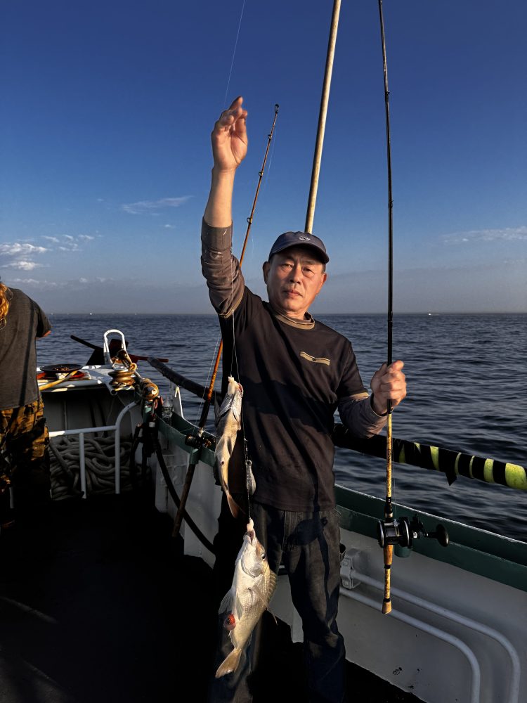 a man standing next to a body of water