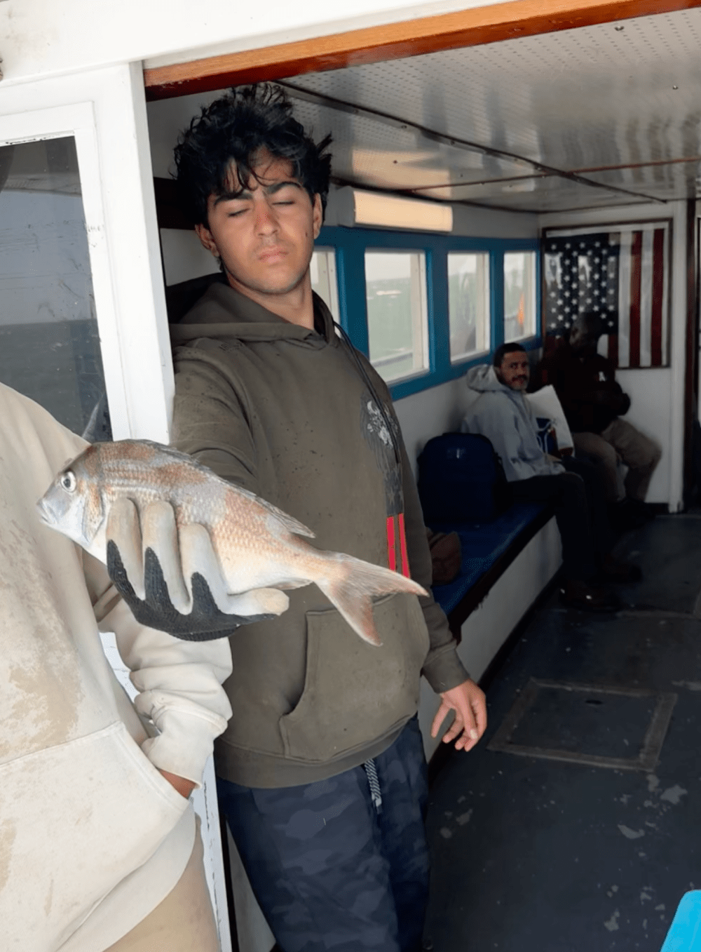 a person holding a fish