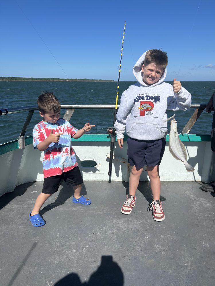 a little boy holding a kite