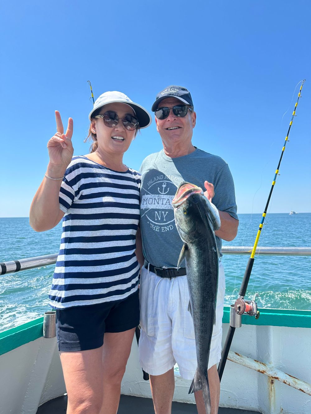 a person holding a fish in the water