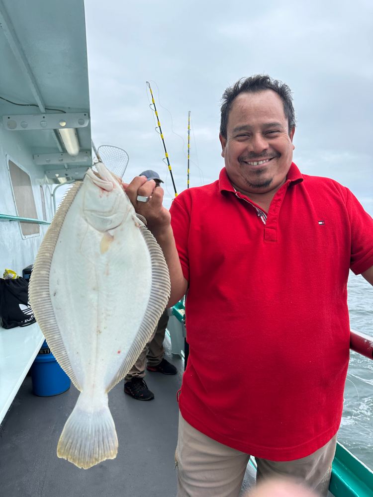 a person holding a fish