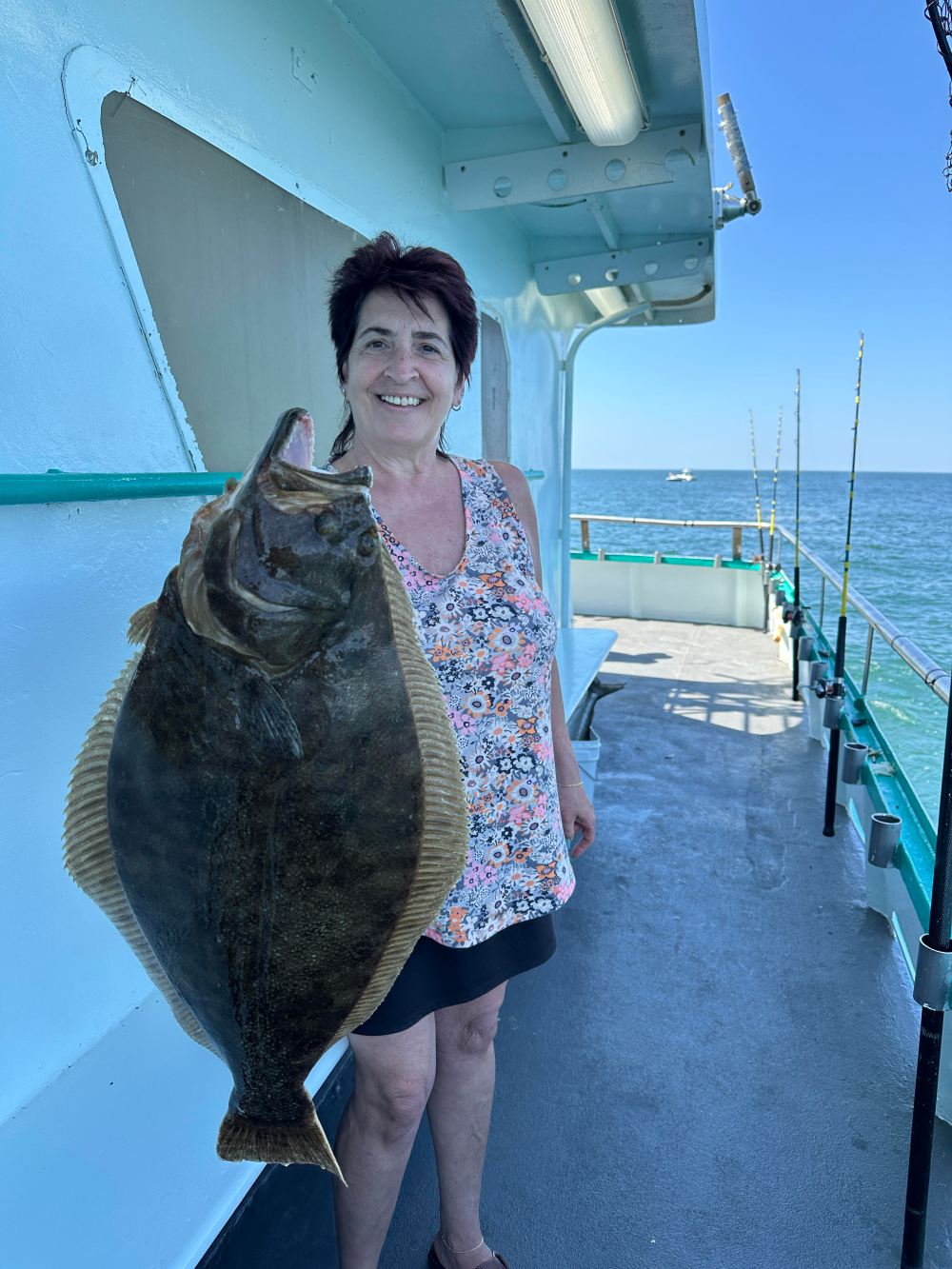 a person holding a fish in the water