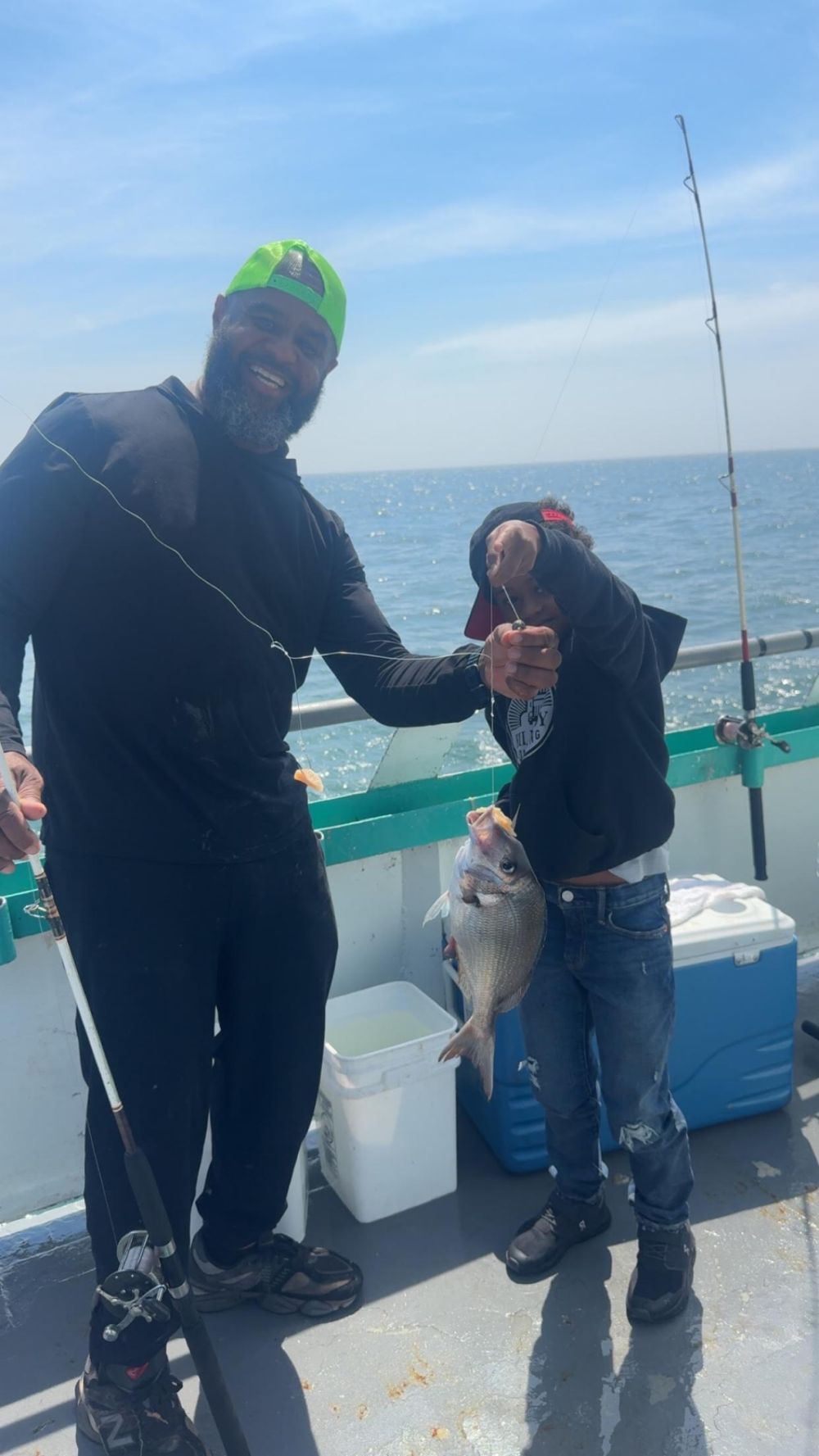 a person holding a fish in the water