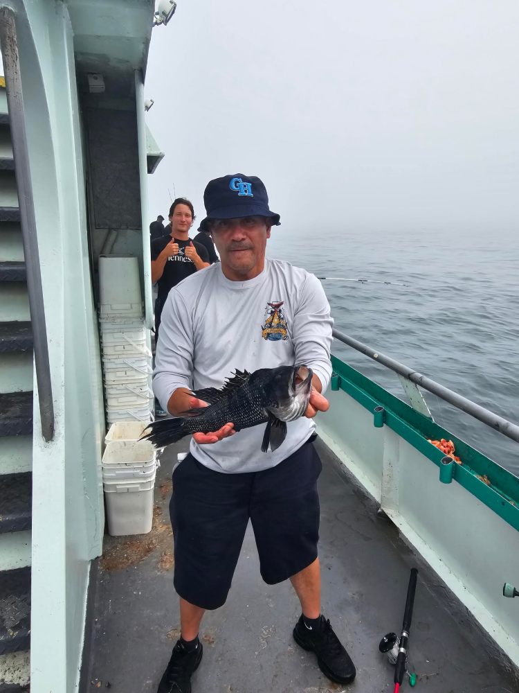 a man standing on a boat