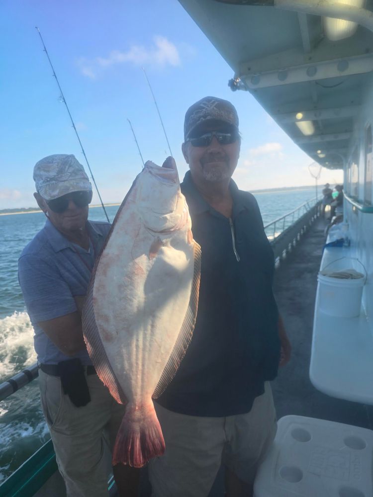 a person holding a fish