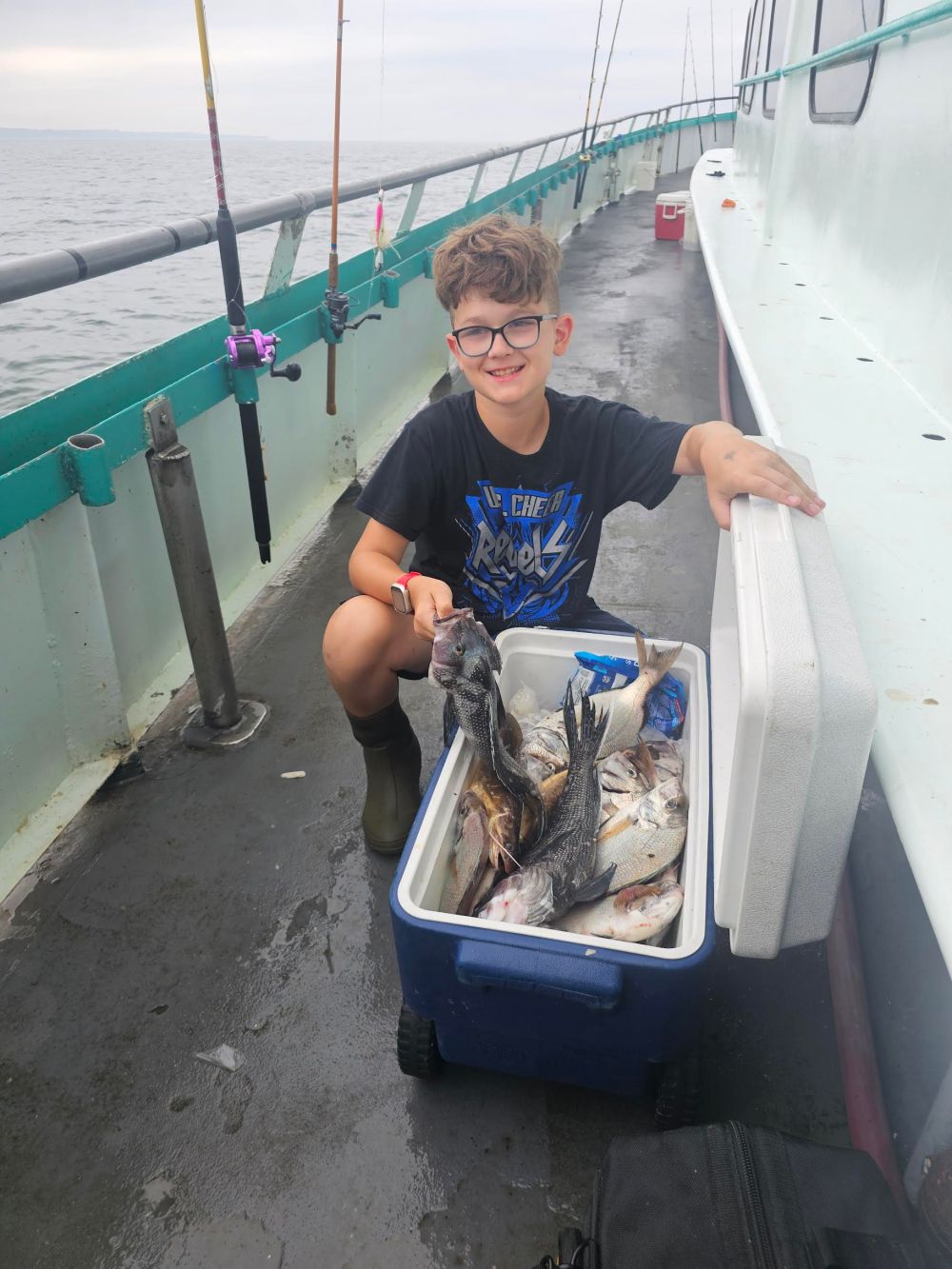 a little boy that is standing in the water