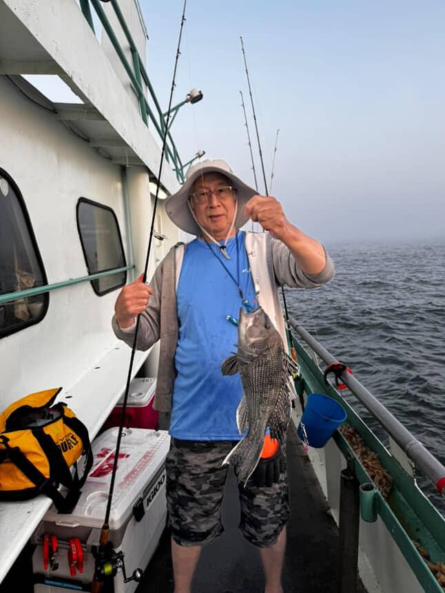 a person standing on a boat in the water
