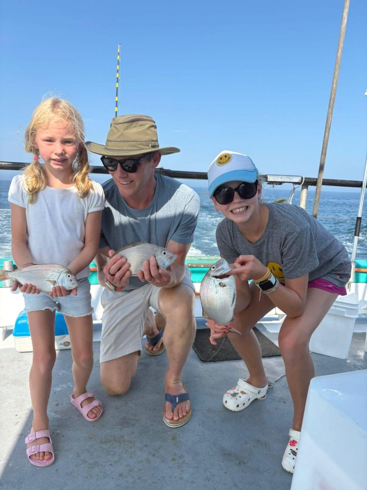 a group of people holding wine glasses