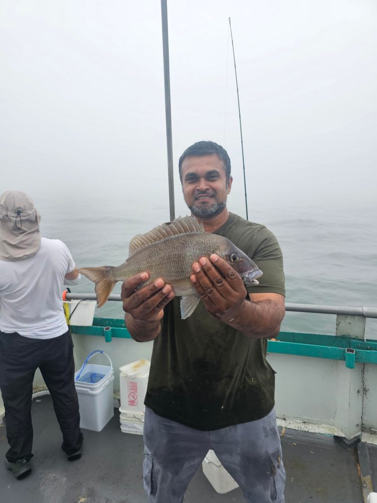 a person holding a fish