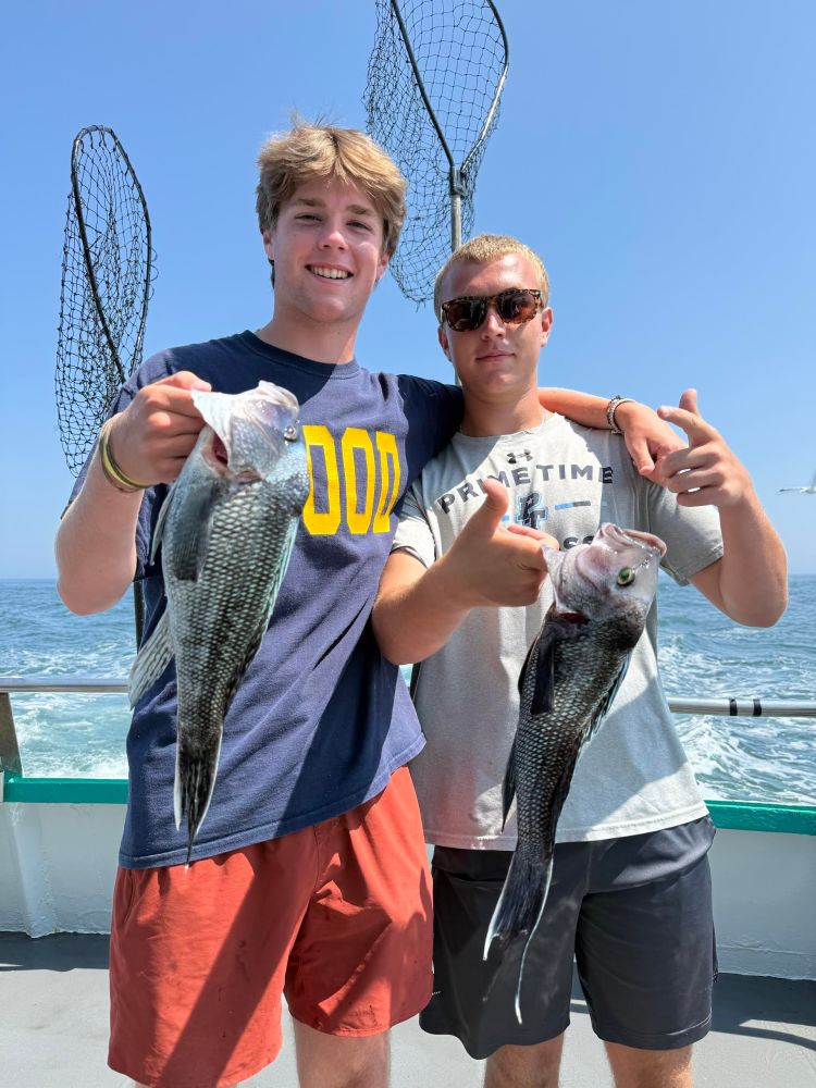 a person holding a fish in the water
