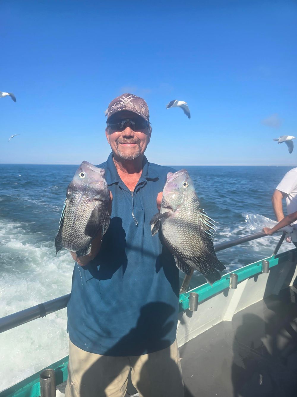 a person holding a fish in the water