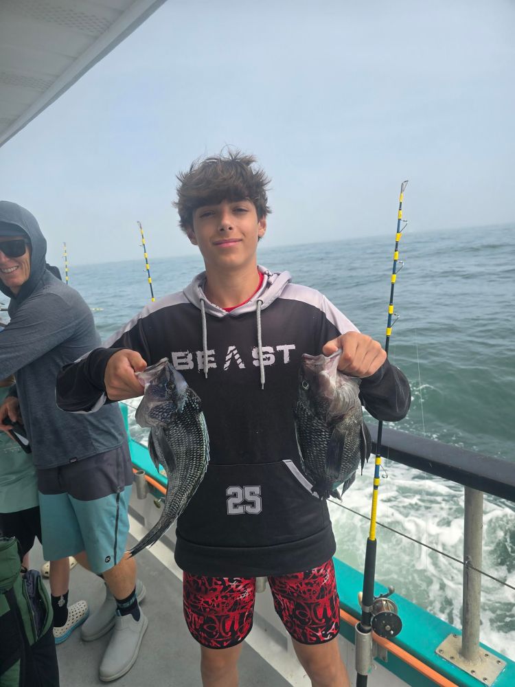 a group of people standing on a boat