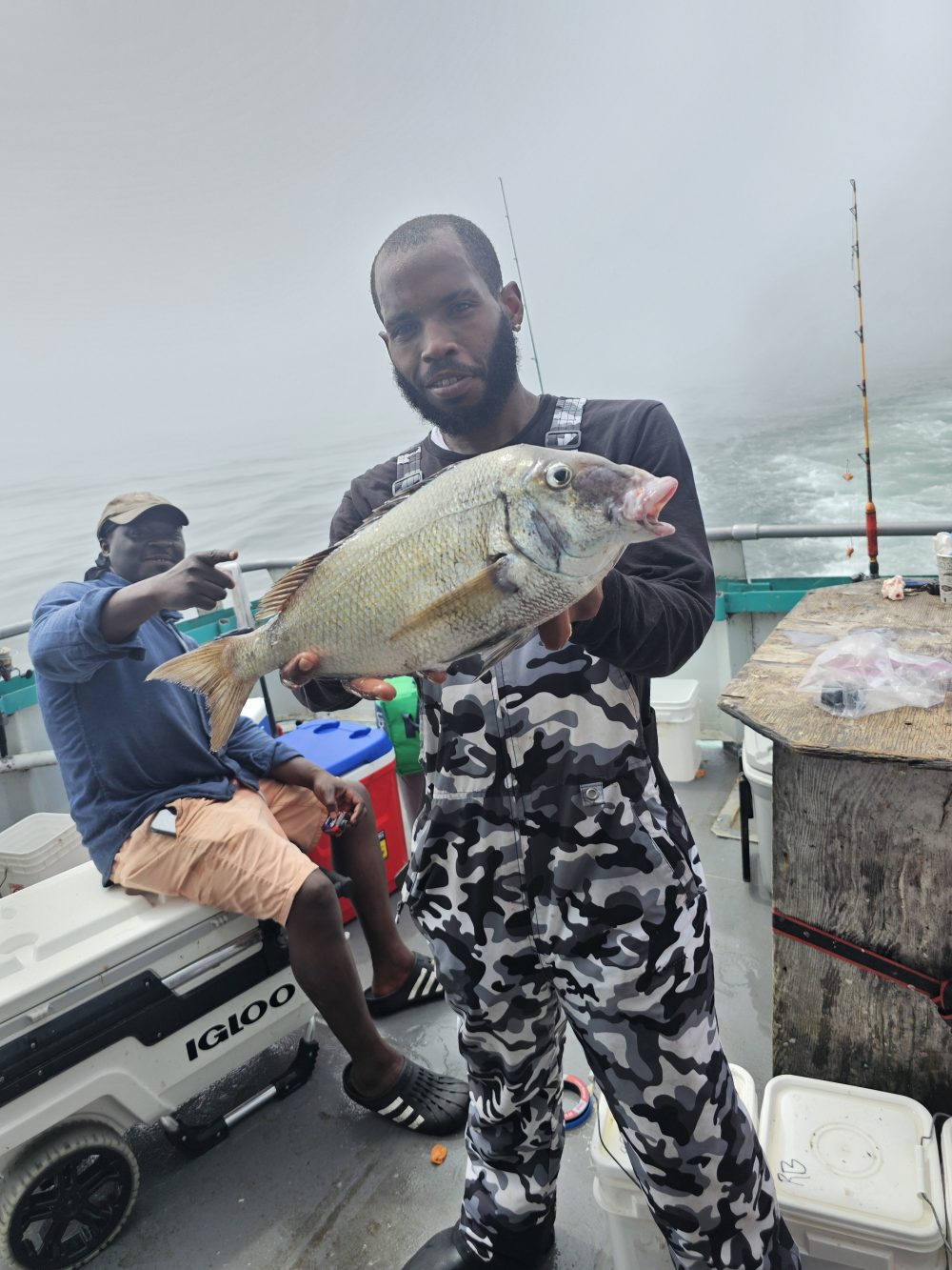 a man holding a fish