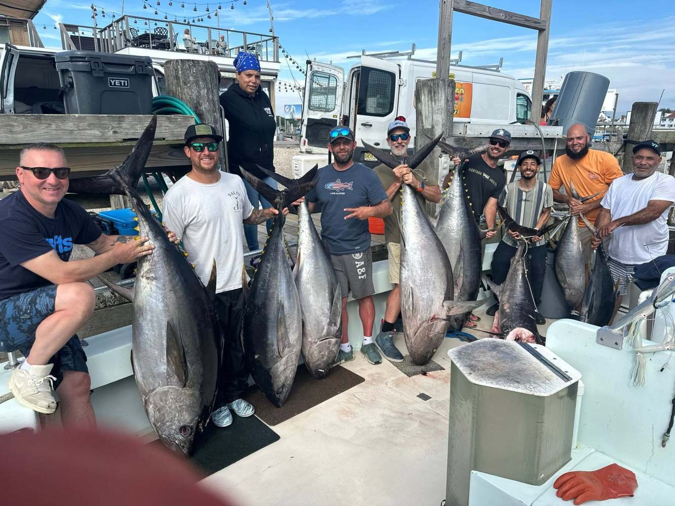 a person holding a fish on a boat