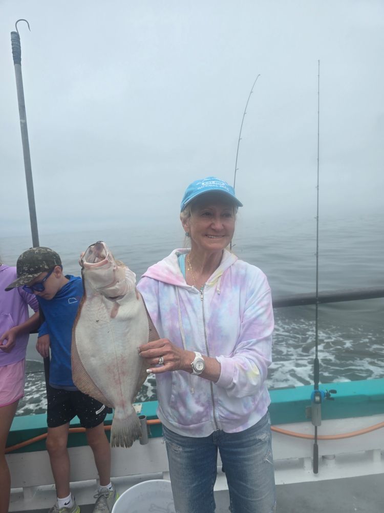 a person holding a fish