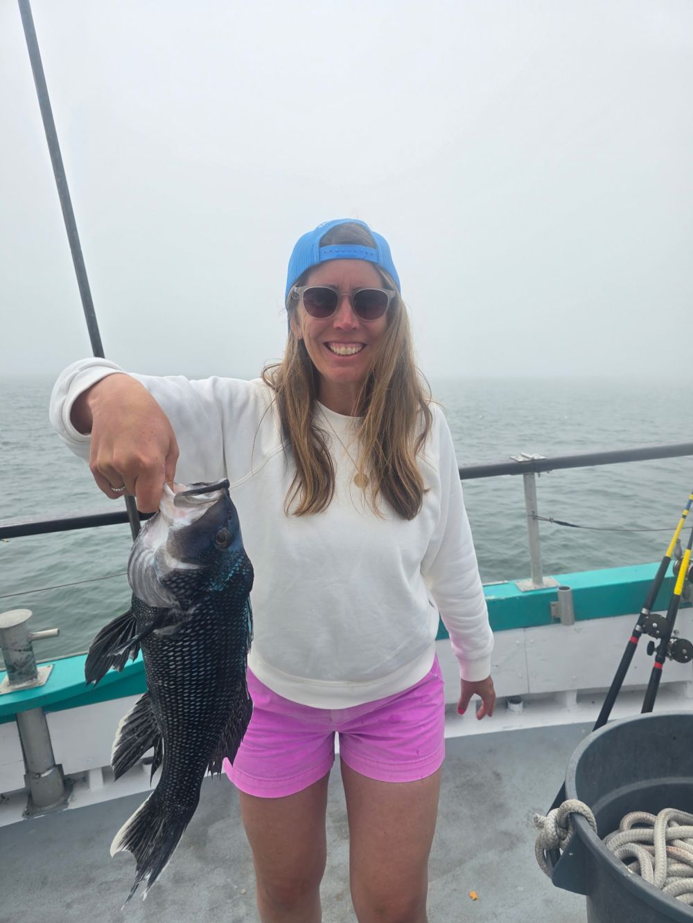 a person holding a fish in the water