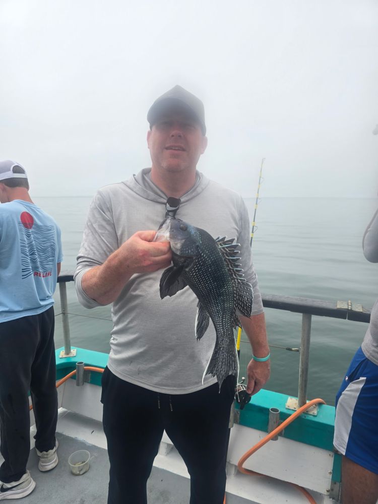 a person holding a fish