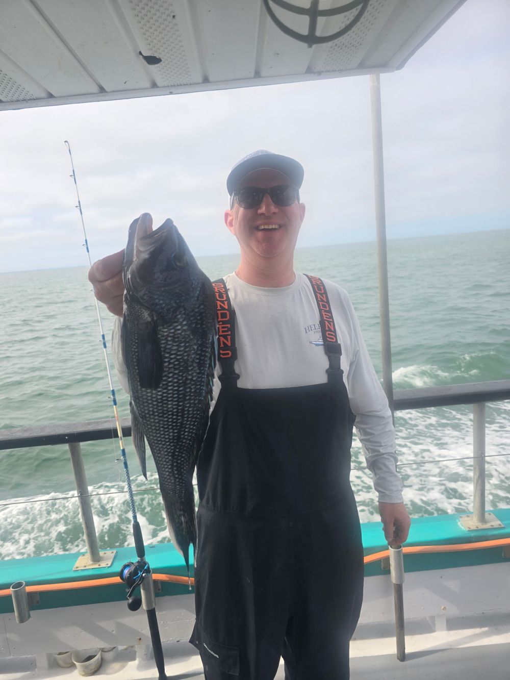 a person holding a fish in the water